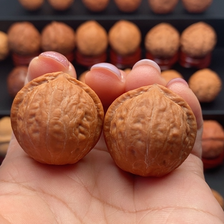 文玩核桃把件精品文玩手捻元宝墎元