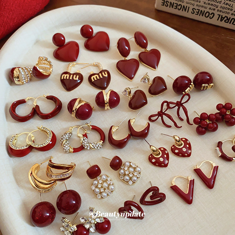 铜合金树脂耳饰 铜合金树脂耳饰安可拉红树脂圆球耳港风耳环时奢