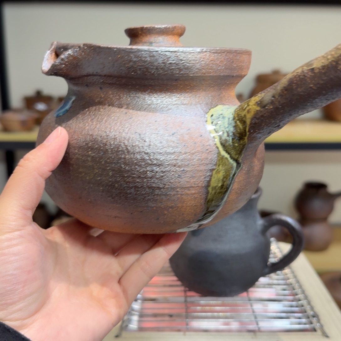 Y***D粗陶裸柴烧侧把罐800毫升