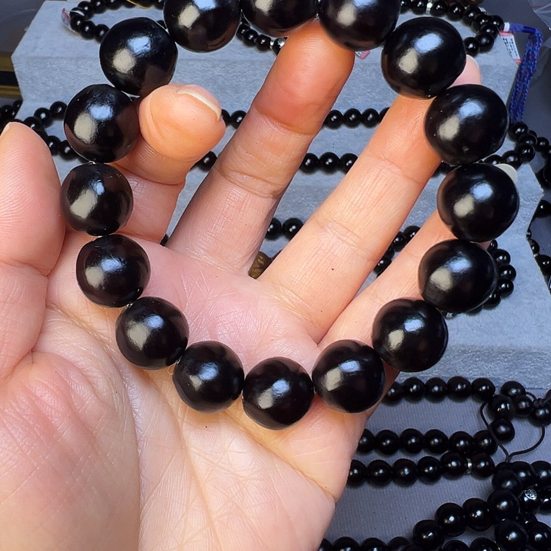 涛***6极致精品卡15.1毫米16颗籽黑色手串