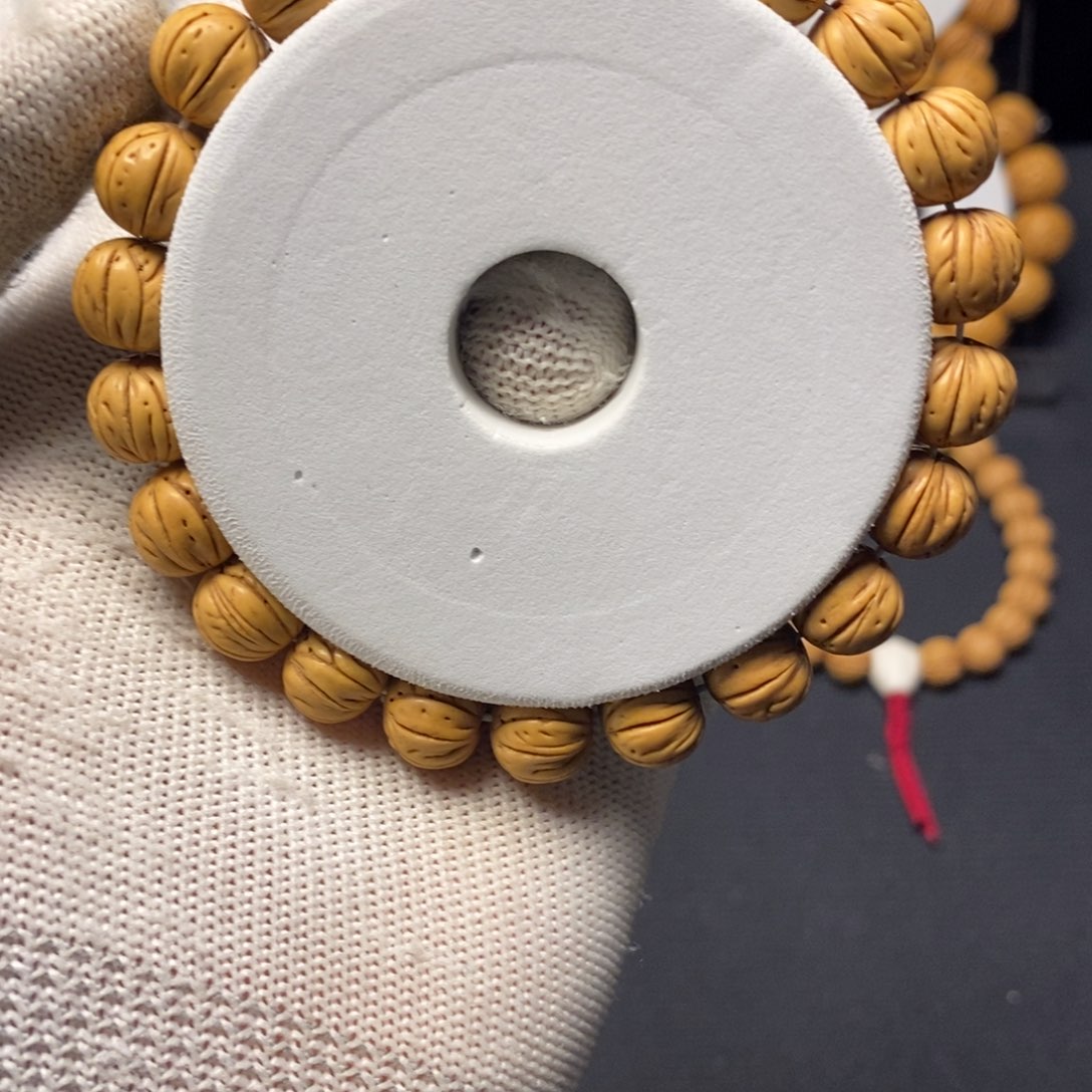 欣****?11尺寸宽脐桃核手串