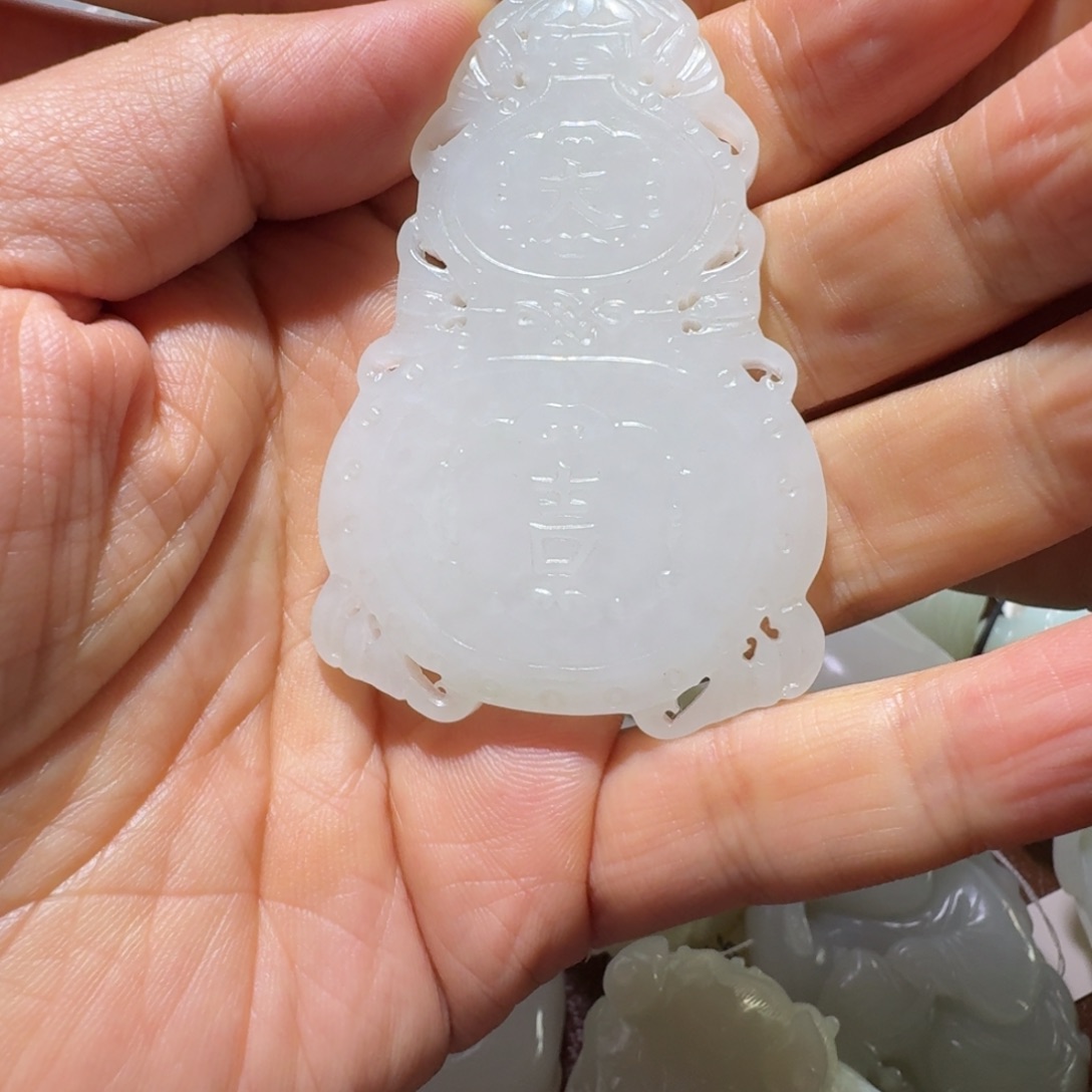 光***事和田玉未镶嵌把件