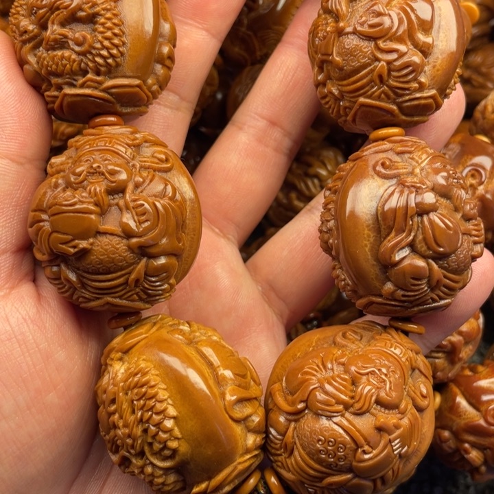 橄榄核吊坠乡**夫橄榄核手持