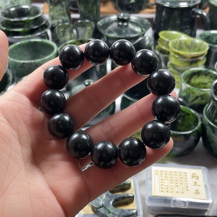 蕙***举蛇纹石玉合金天然药王石卡20手串