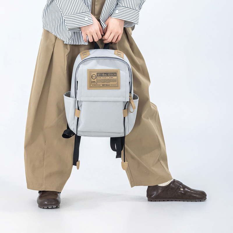 书包男大学生女生高中初中生轻奢工装风电脑背包旅行双肩包大容量