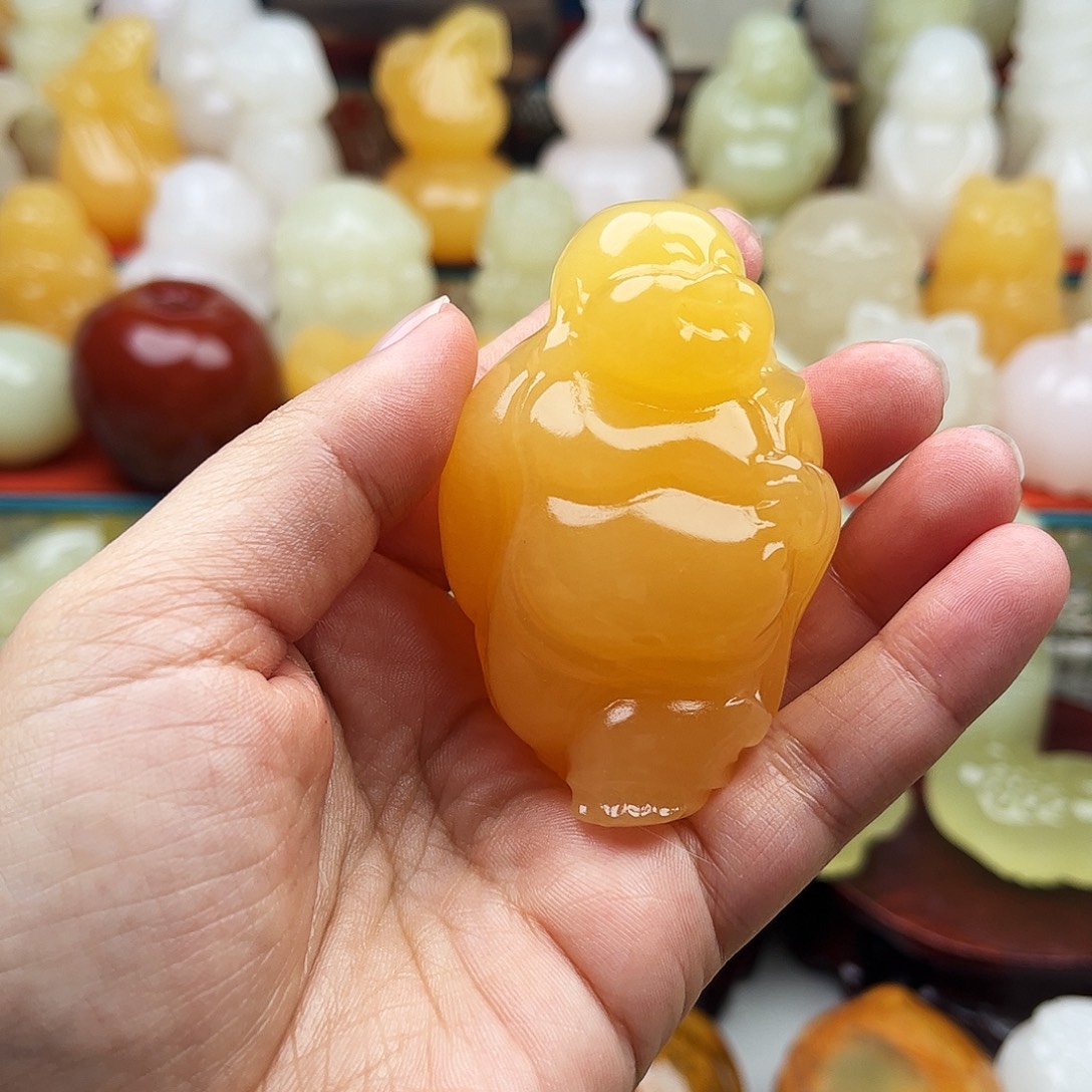 雨***哥石材大肚佛手把件