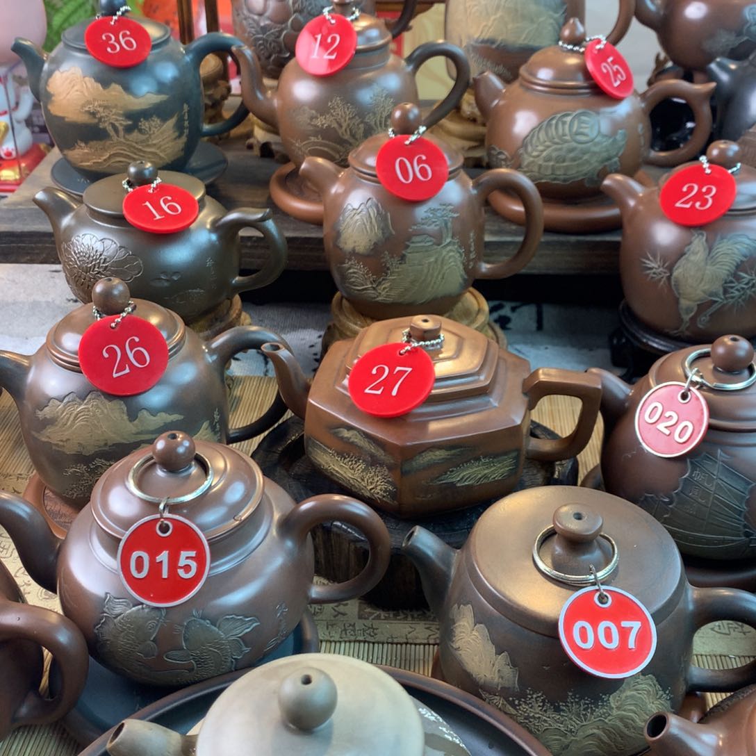 圣****台坭兴陶手工刻绘柴烧山水壶