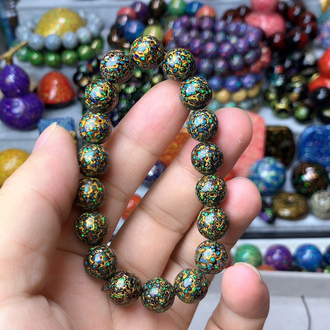 别*.大漆欧珀1.0*18颗黑金手串