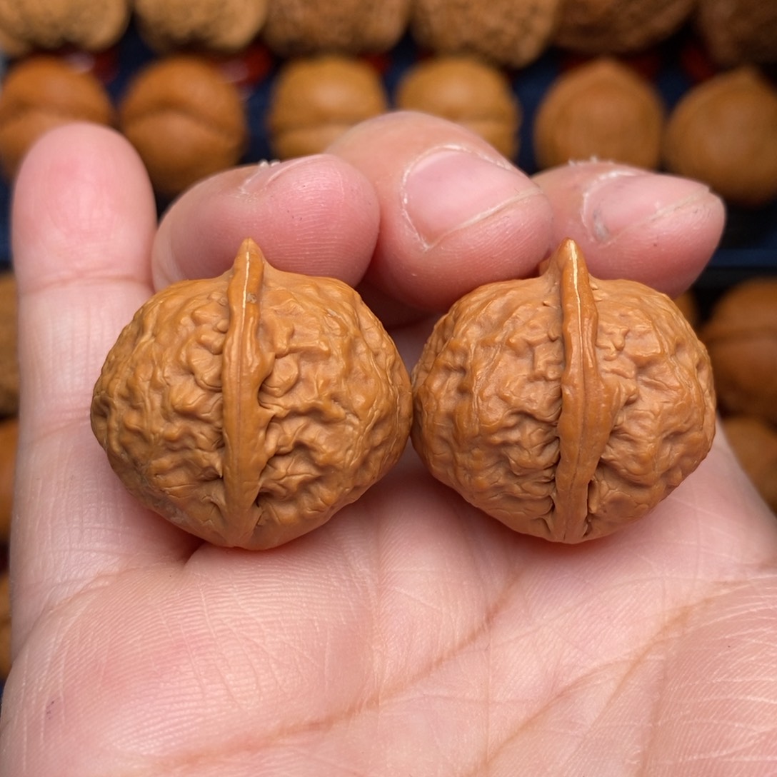 文玩核桃把件手捻佛肚元宝