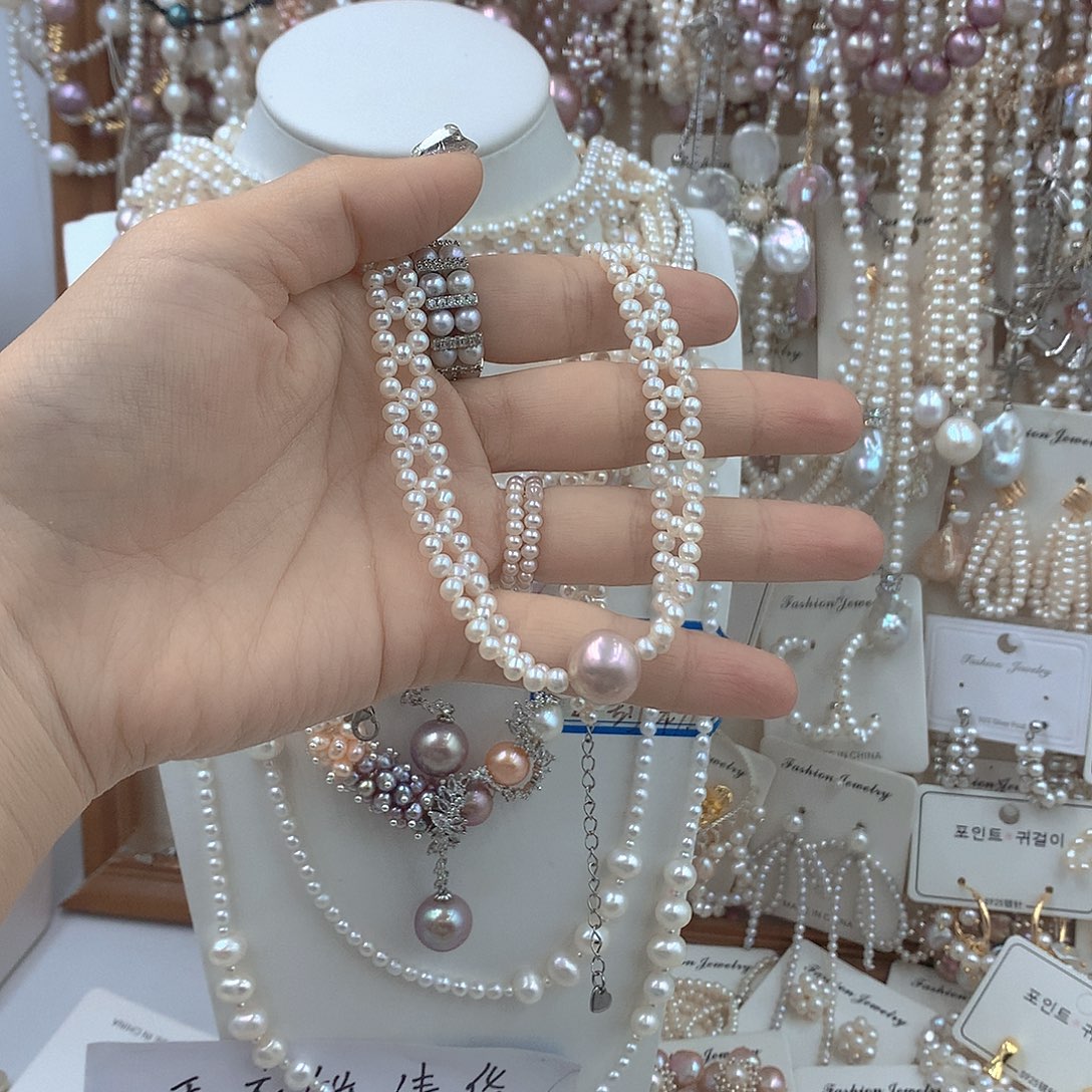 尹***爽淡水珍珠银S925镶嵌耳饰