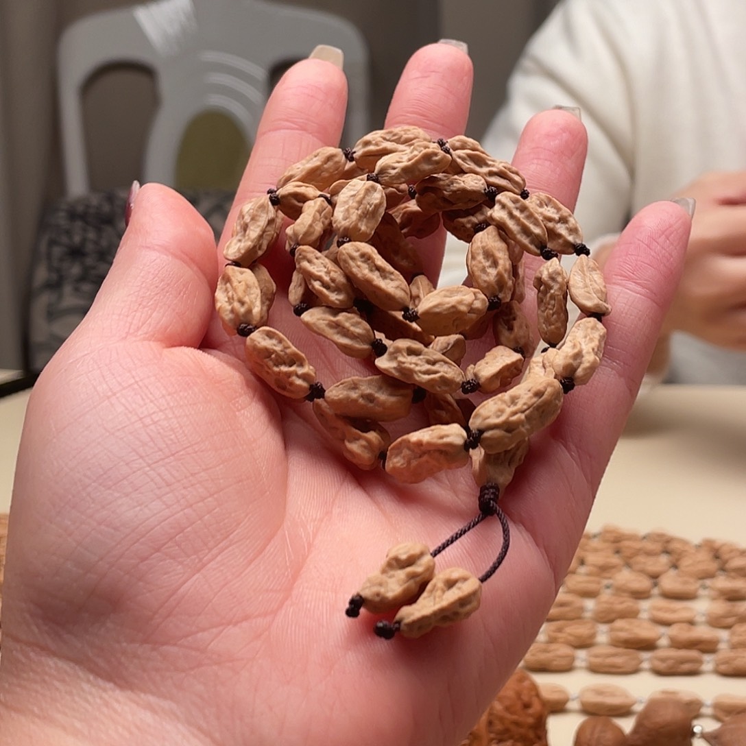 䔸***勒手串桃核异形脖挂