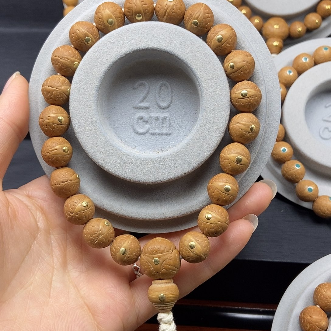 陈***凤眼菩提手串12.5➕铜，25年籽