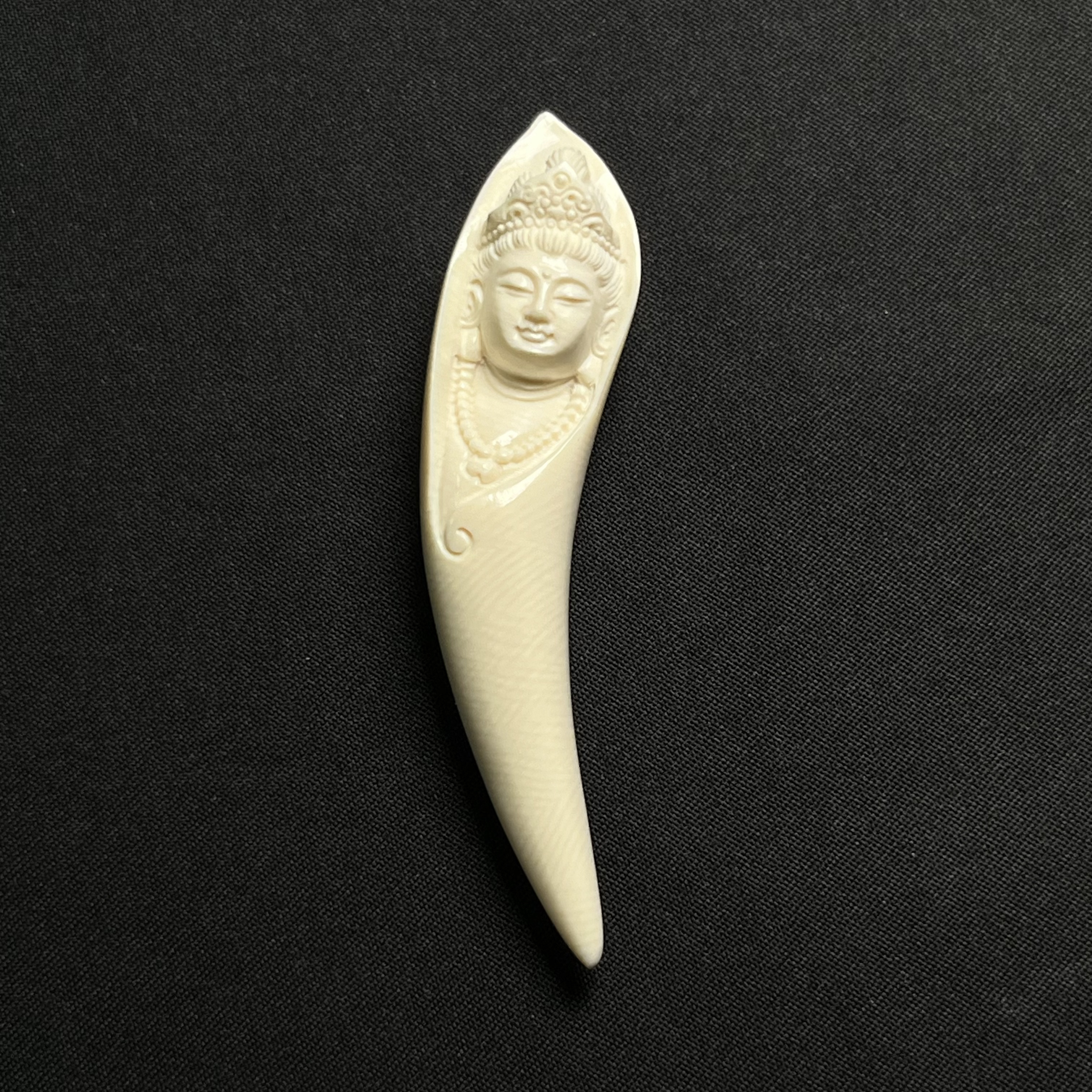 DY22观音牙尖尺寸约68*15*13MM，重量8.8克 只做天然猛犸牙