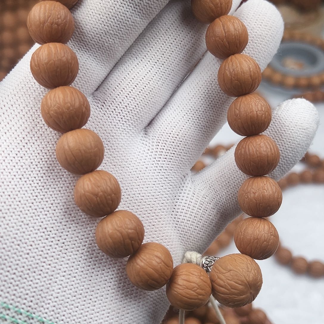 T***e猴头核桃手串聚宝盆