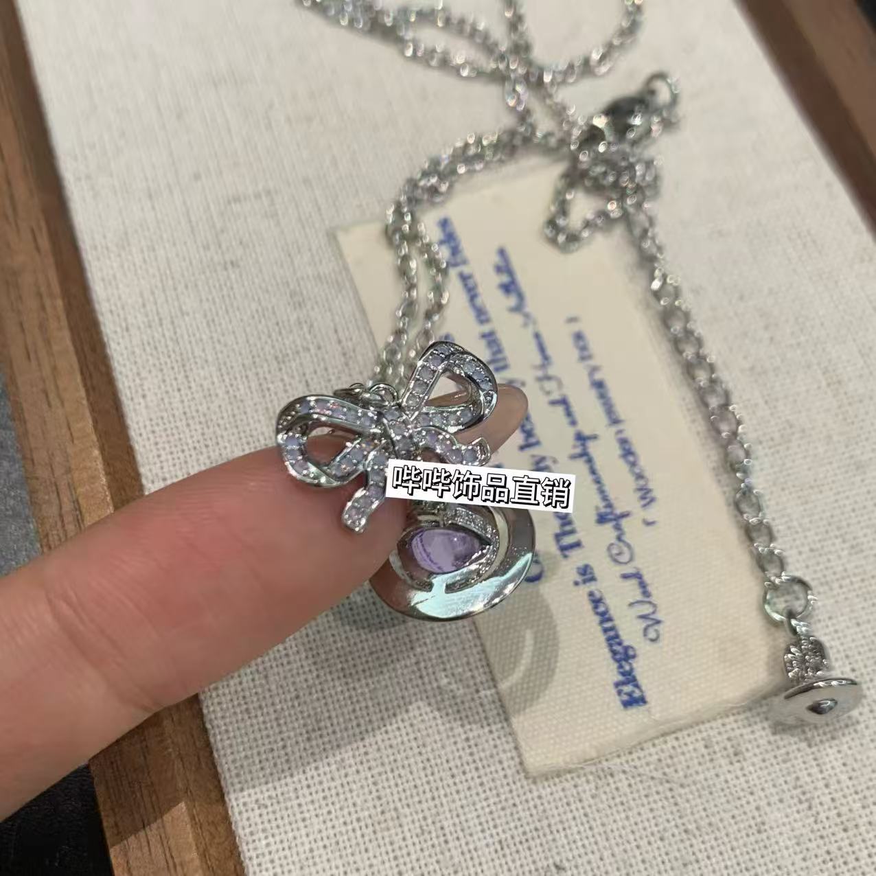 钛钢项链 BIBI【紫色蝴蝶结星球项链】G024