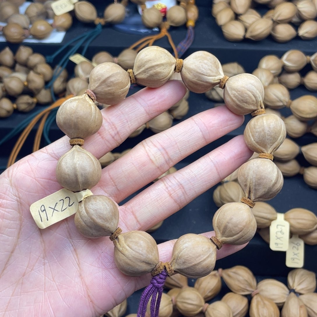 R***.001橄榄核三花19*22