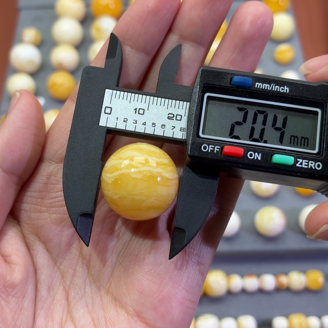 幸***星琥珀未镶嵌裸石圆珠