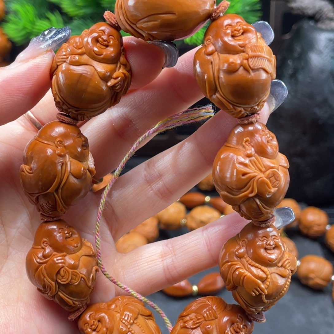 阳***孩橄榄核手串/手链6484弥勒