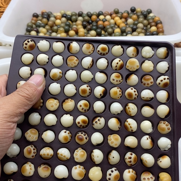 玉***琚吊坠白玉菩提瑕疵12炭烤猫爪100颗