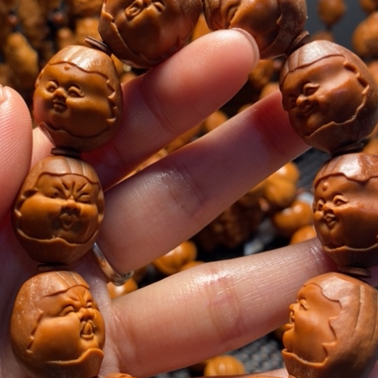 橄榄核吊坠包衣百态