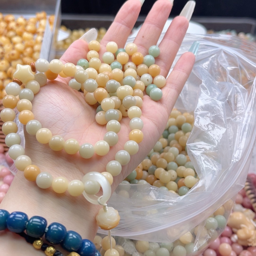 白玉菩提吊坠q8mm/100+10颗晴水多宝