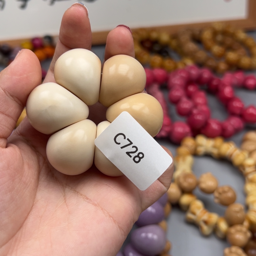 c***n吊坠菩提根/象牙果C728蒜瓣25-27瑕疵一串