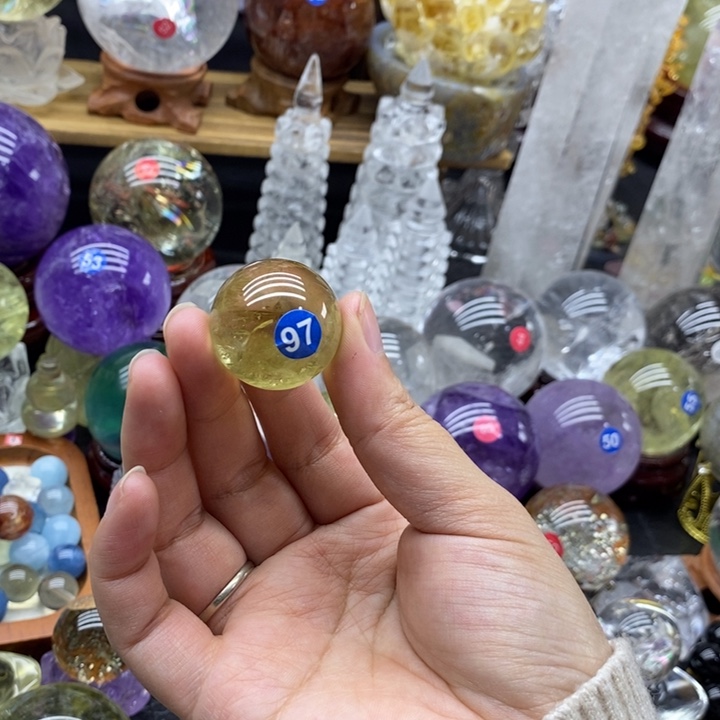 美***洋石材天然黄水晶球