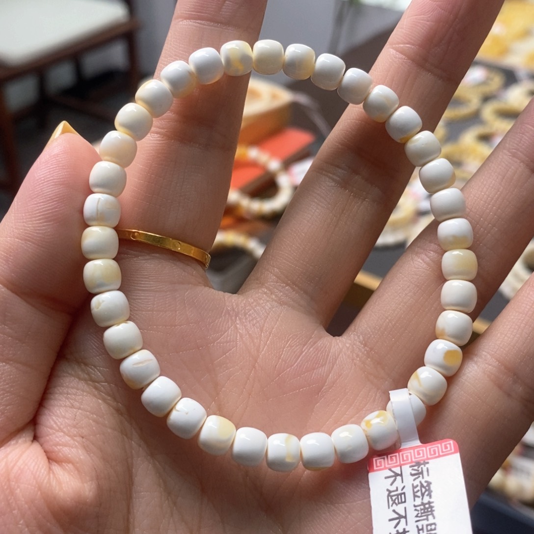 琥珀裸石未镶嵌T**S6*5.4金漆白老型手串
