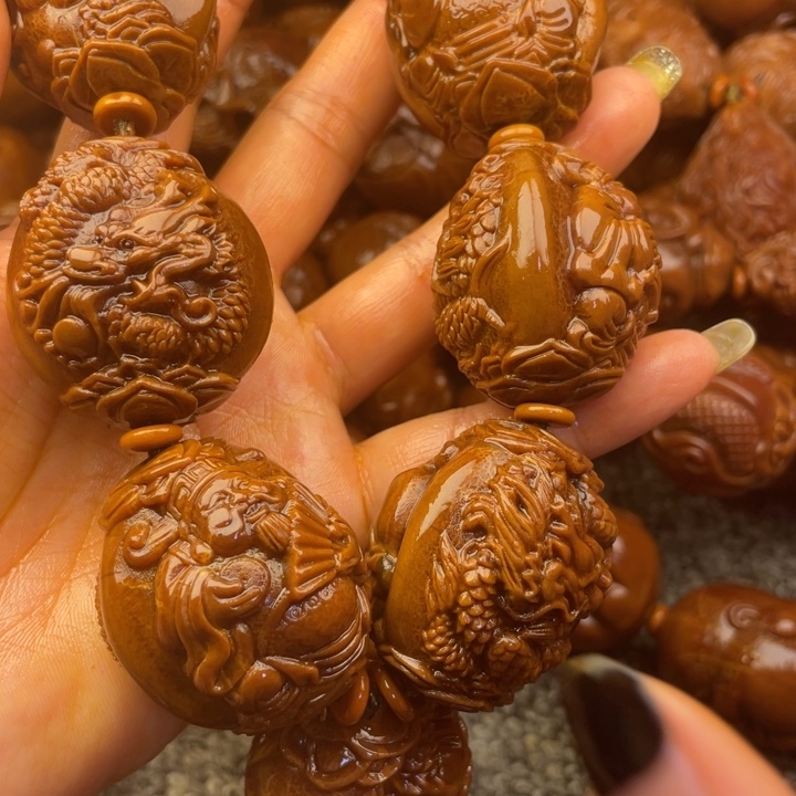 橄榄核吊坠开***乐橄榄核