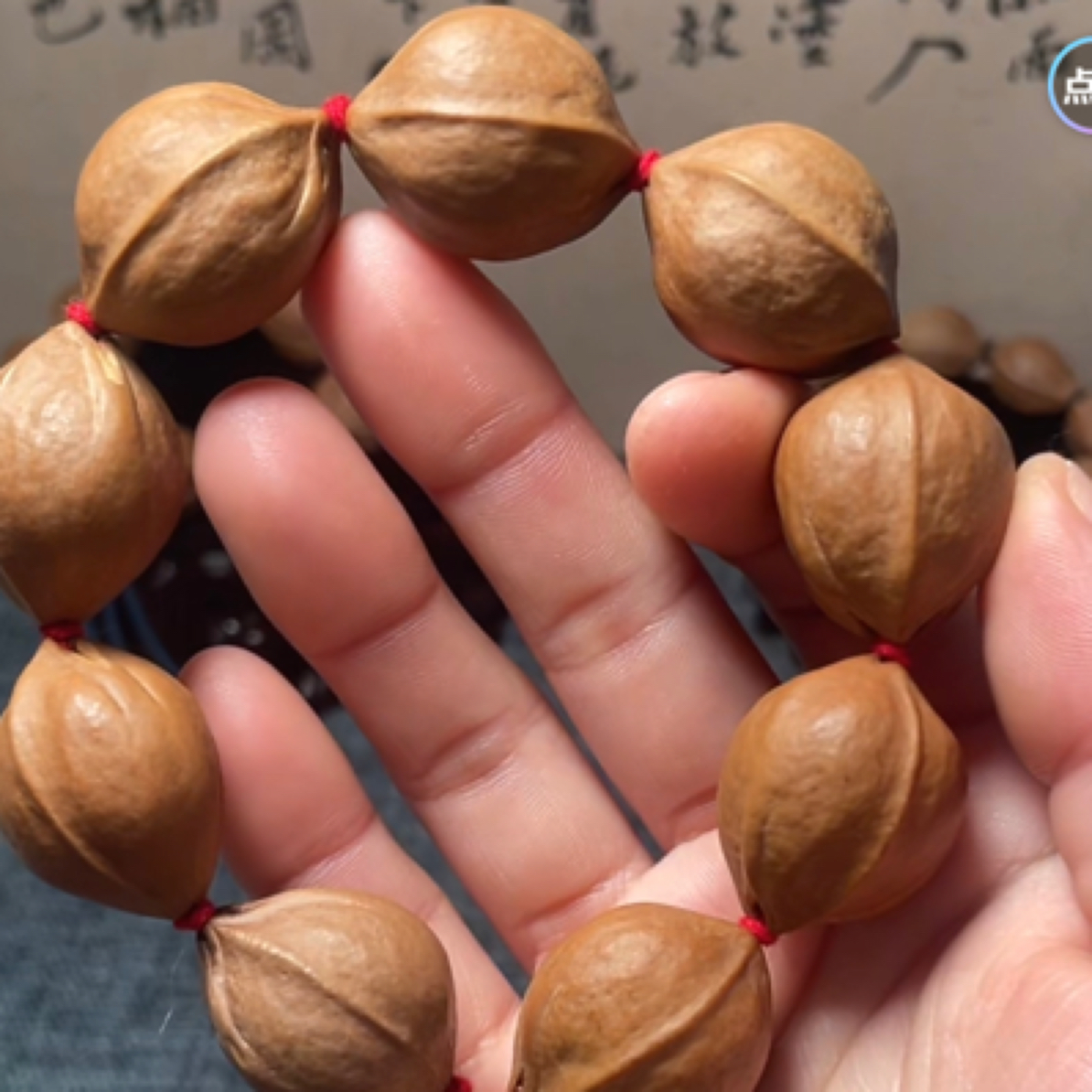 2127梅林铁三花橄榄素核手串