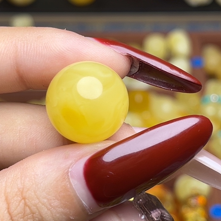 黎***@蜜蜡未镶嵌珠宝奇石鸡油黄妖花圆珠微瑕