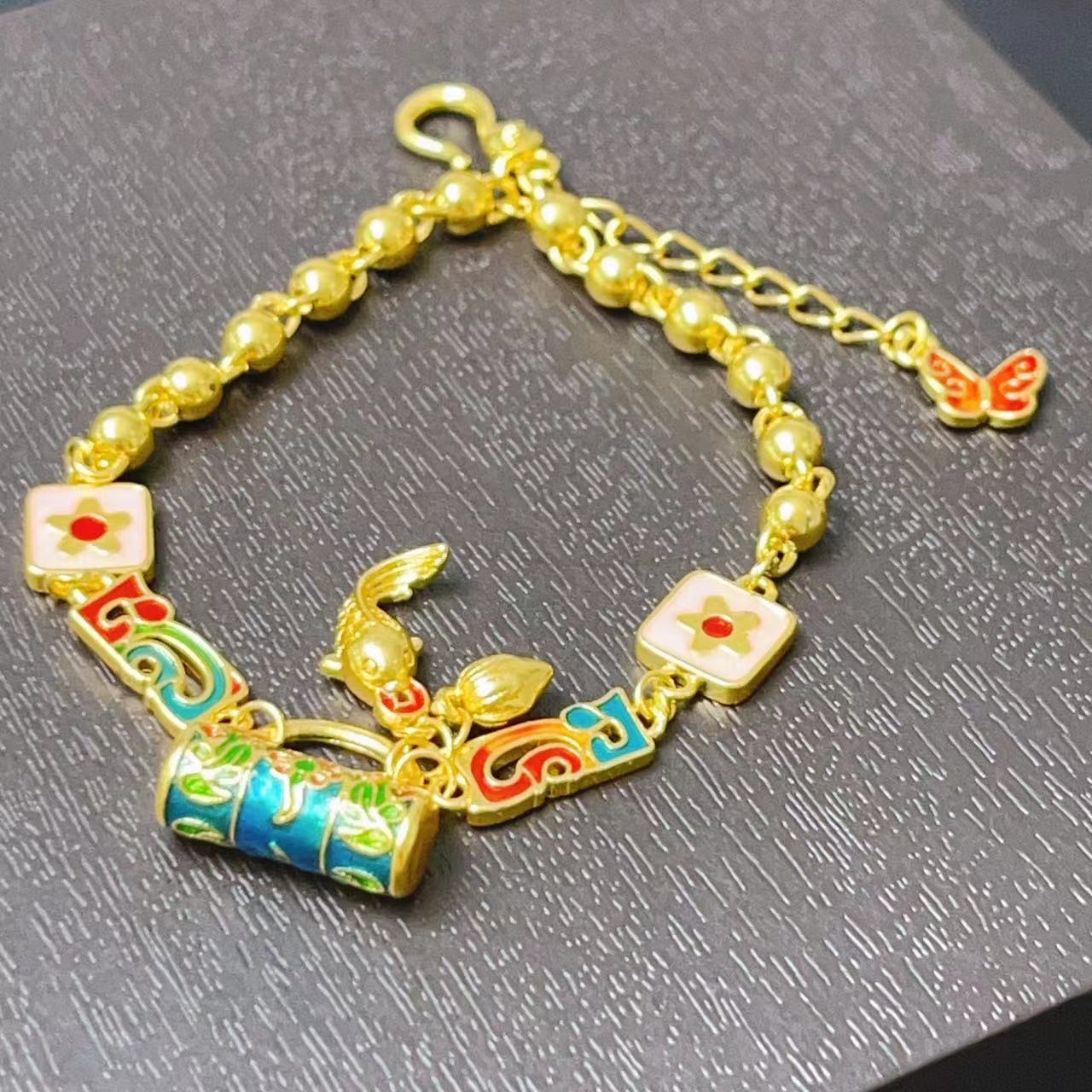 L-8300  足金珐琅彩手提包小鱼手链