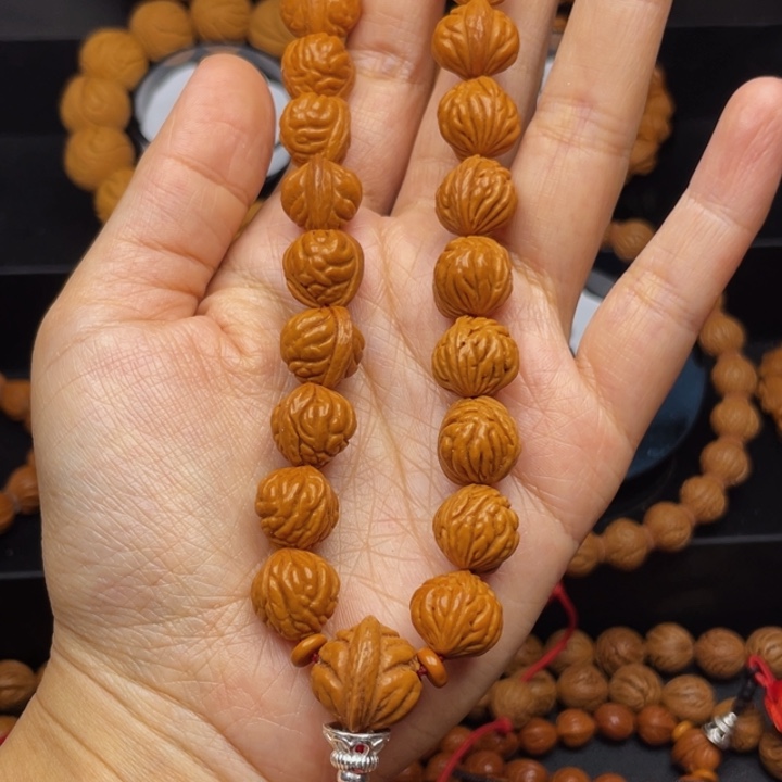 天***草桃核吊坠金豆手串