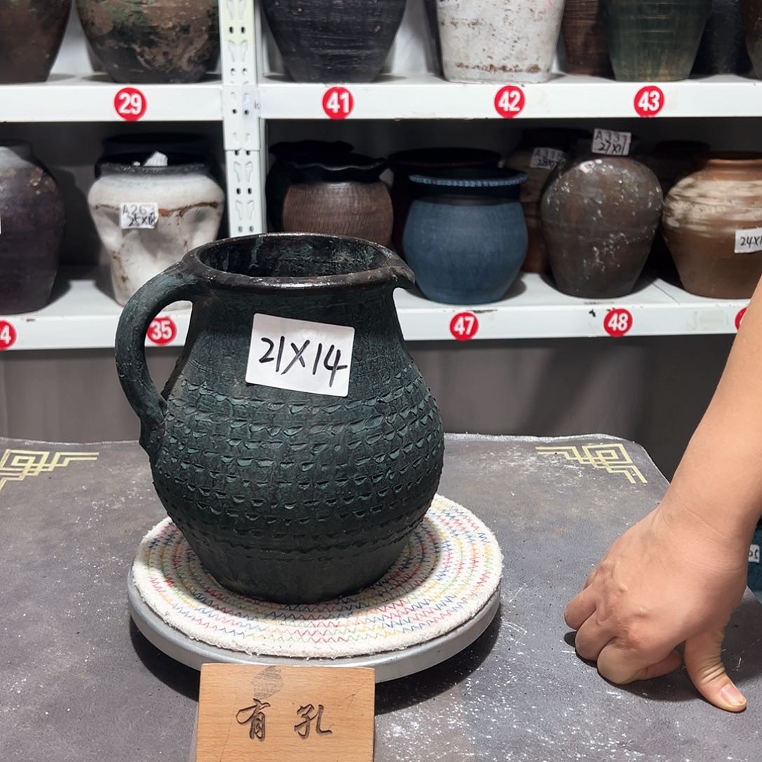 红陶单耳绿壶有孔有孔
