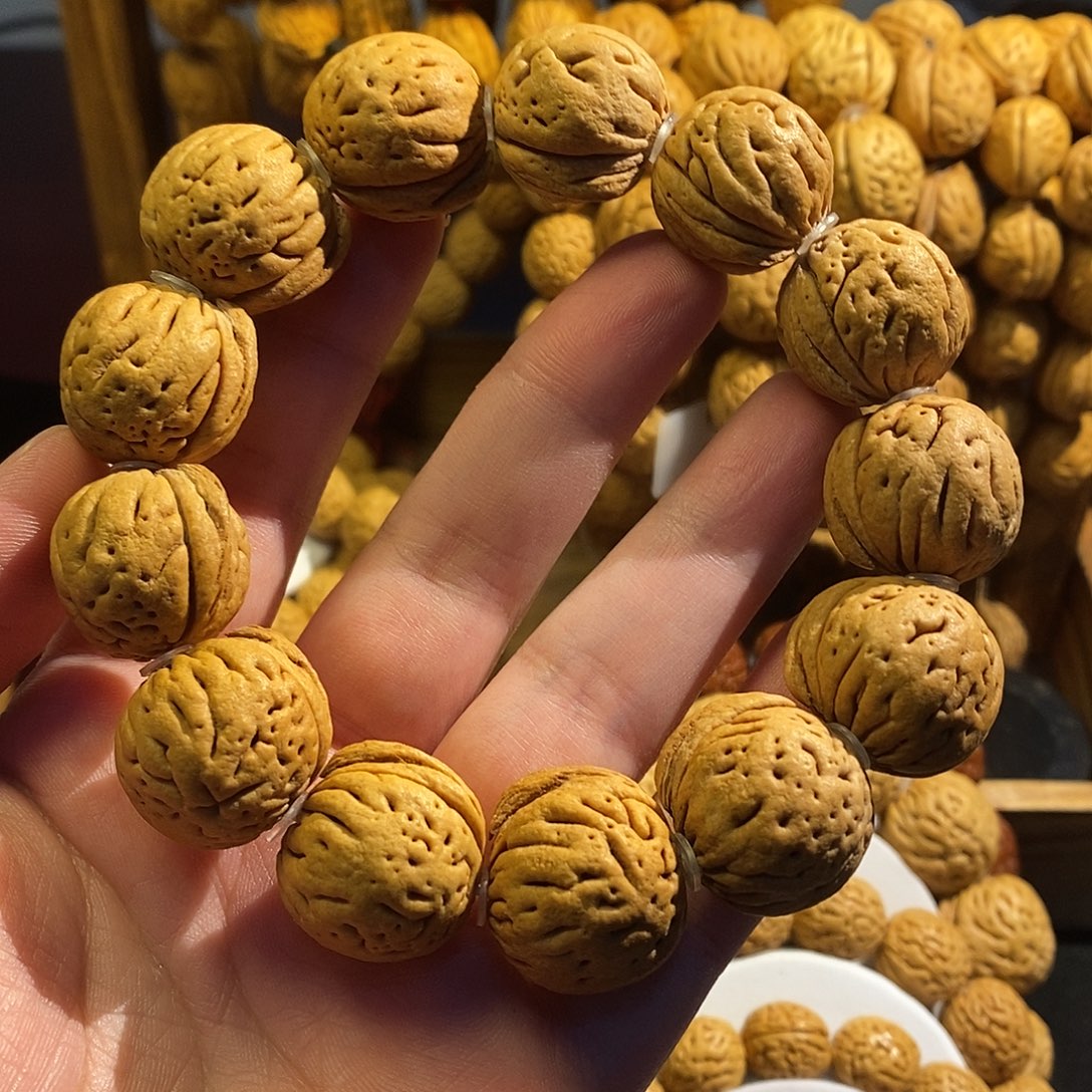 手串桃核盘锦刀齐肉球