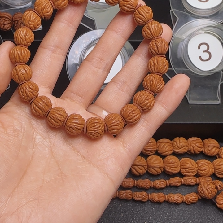 那***月桃核手串龙纹桃核