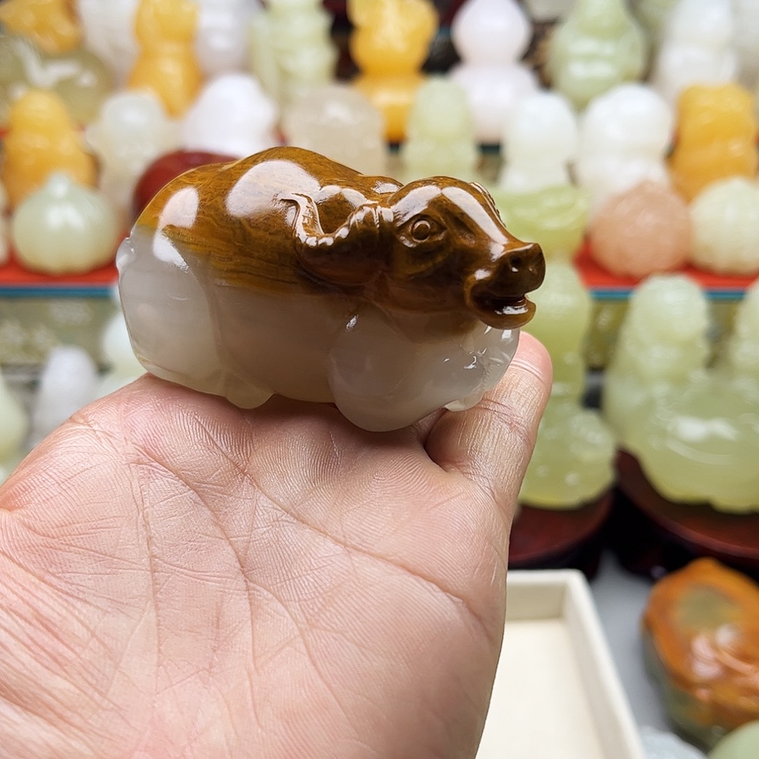 海***机石材牛牛手把摆件