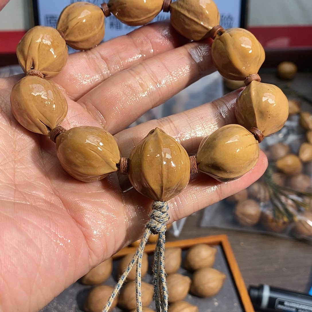 丶***茧橄榄核手串22x26四花三通