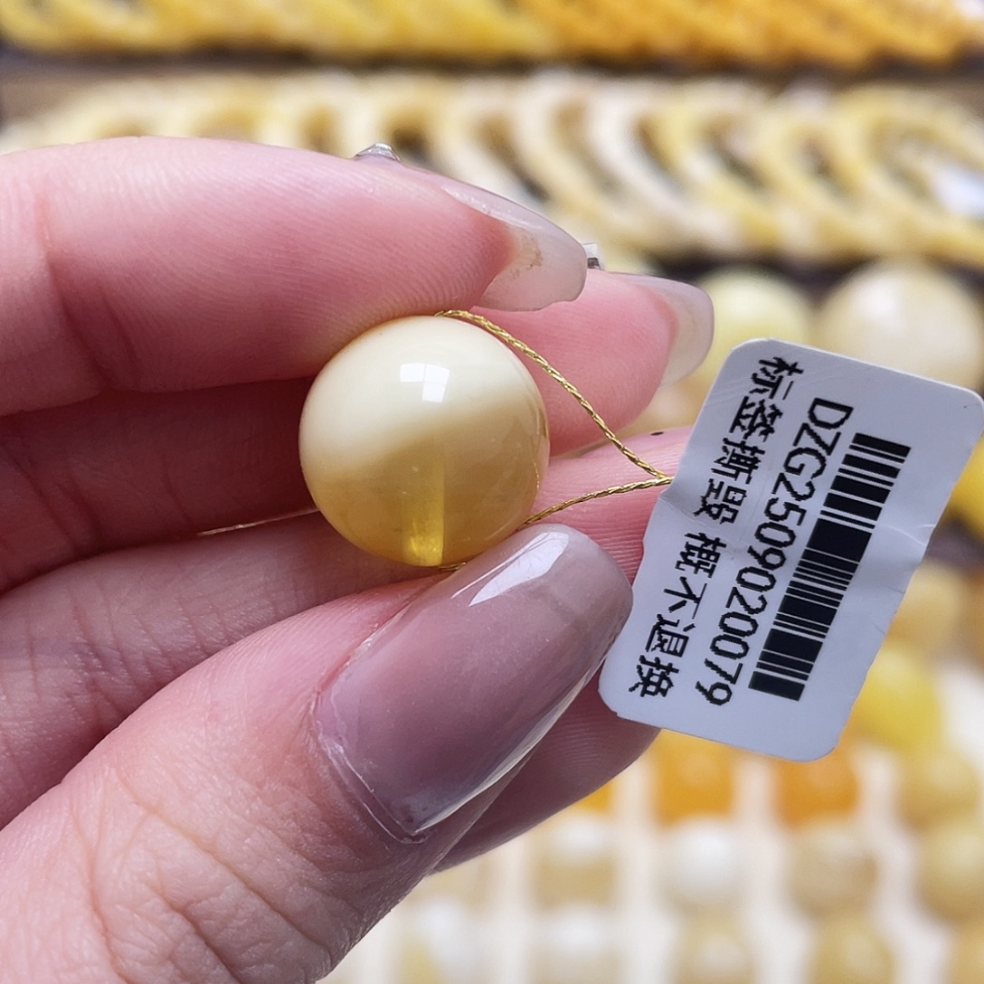 光***明琥珀未镶嵌裸石13.9mm圆珠瑕