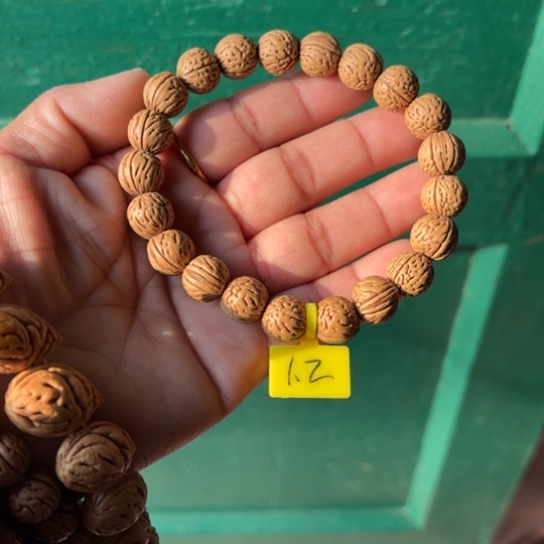 鱼***行木质野生桃核手串