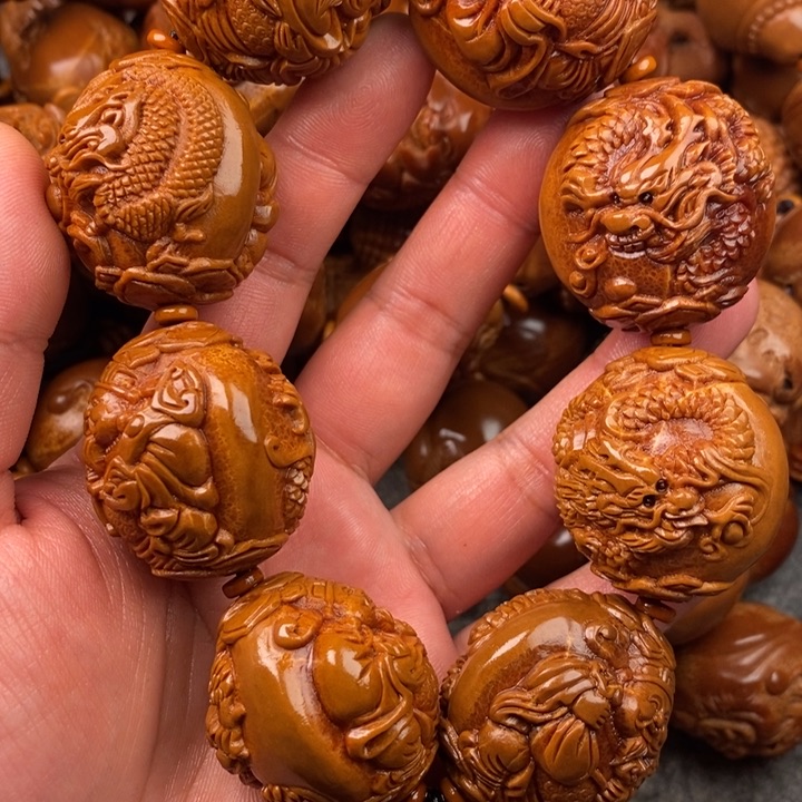 橄榄核吊坠江**览橄榄核手持