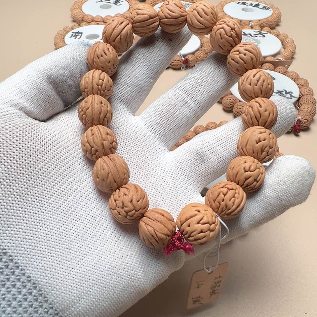 星***空桃核手串1.4红皮大肠纹