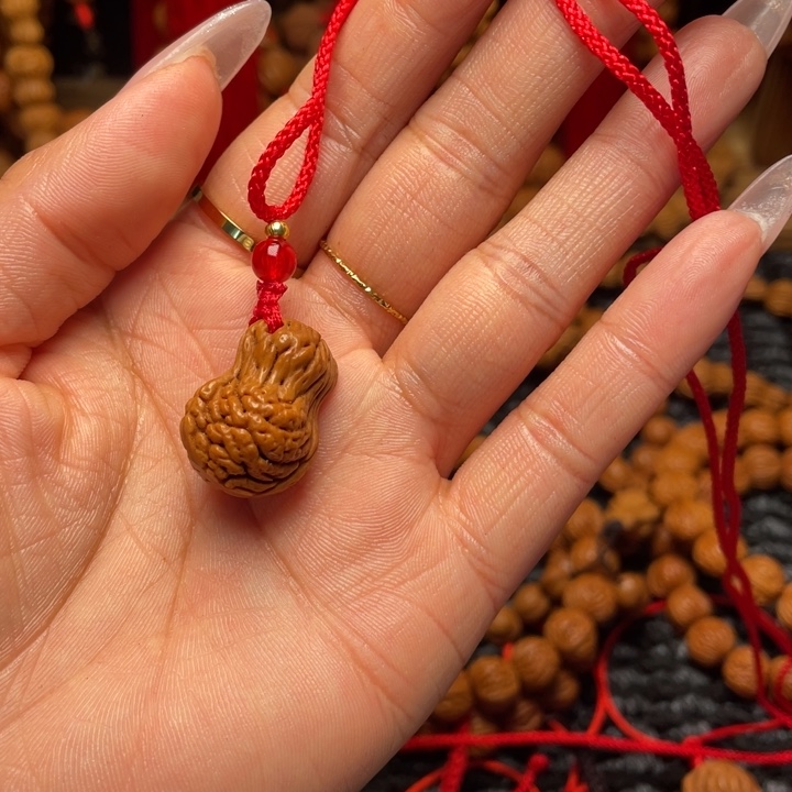 哎***喂菩提籽类龙纹桃枭挂件