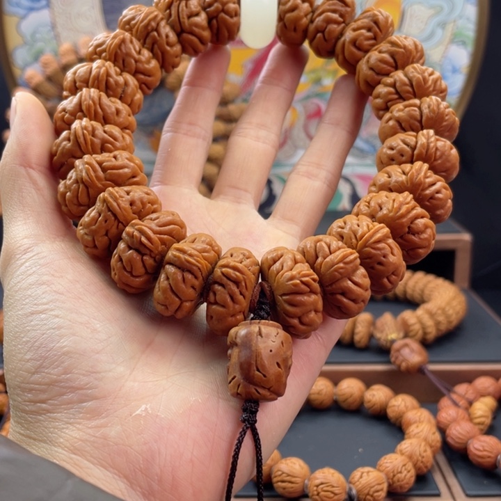 桃核手串陈***民龙纹桃核白玉龙