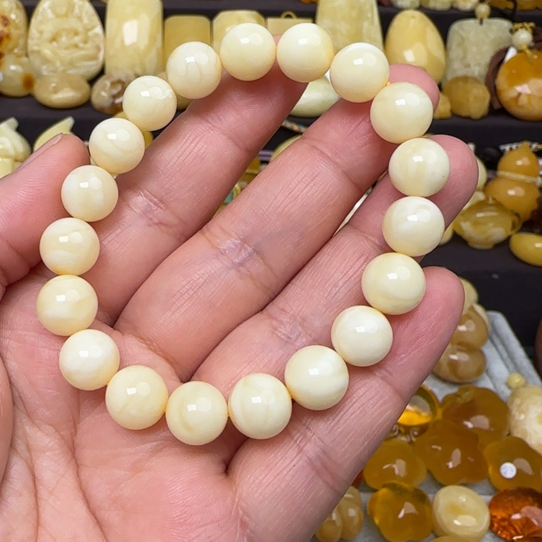 蜜蜡手串未镶嵌施*?天然白蜜圆珠手串