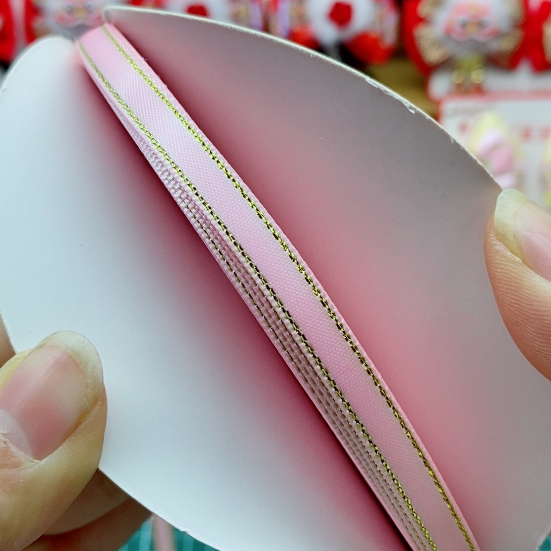 0.6金边涤纶带粉色一卷50码