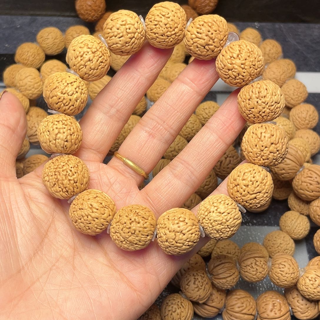 桃核手串你****?18龙鳞凤尾手串