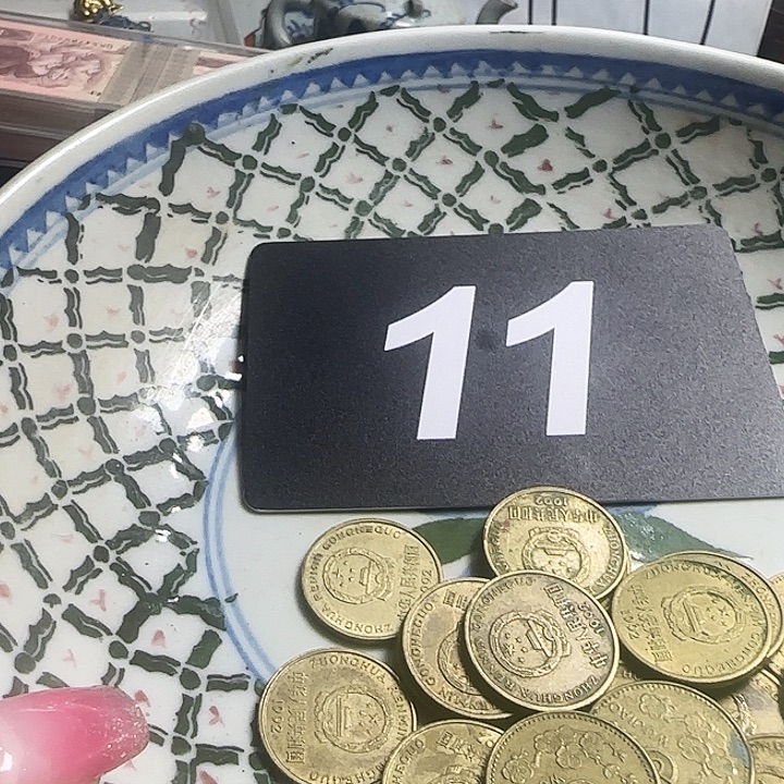 伟***铜铁合金类退市梅花硬币