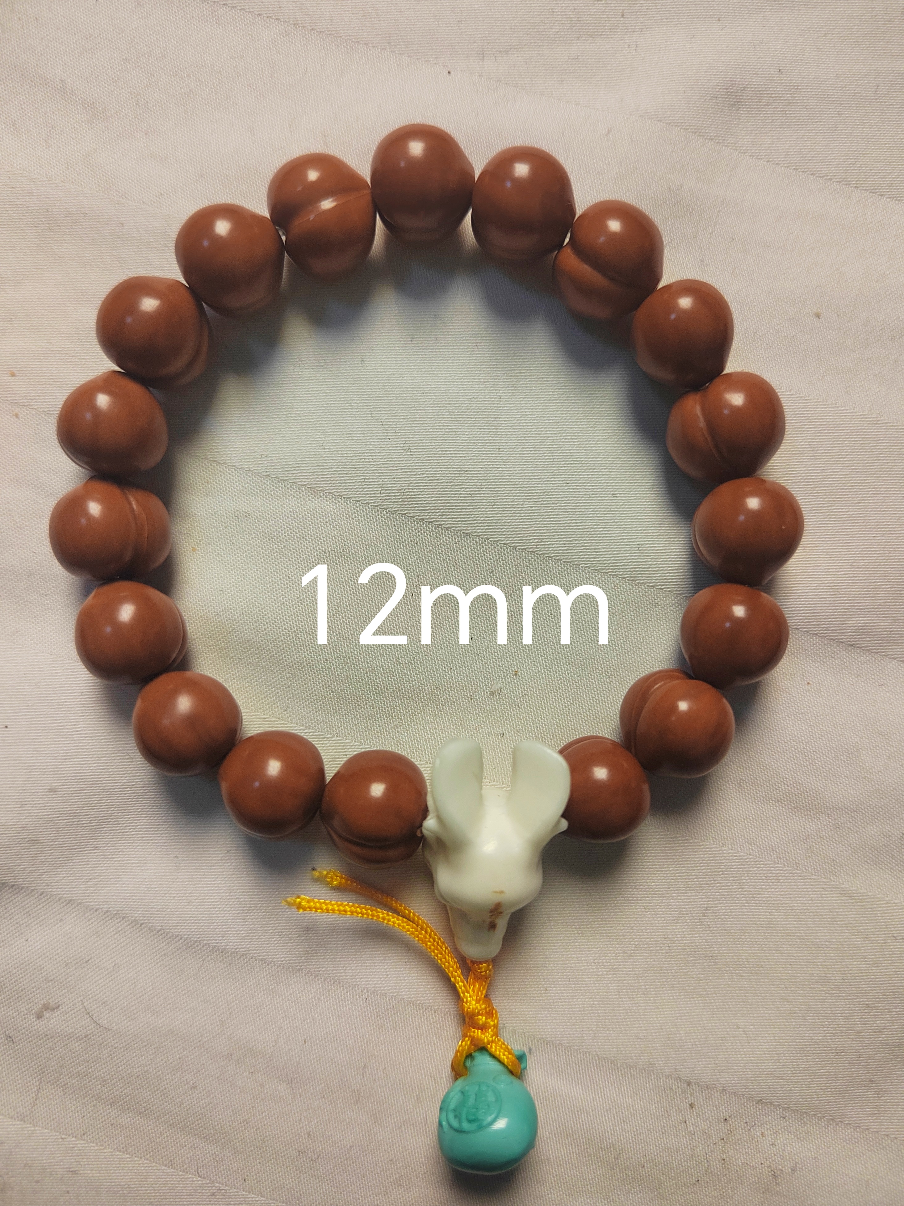 全品猴头核桃屁桃爱心手持聚宝盆雕刻光面微反油文玩