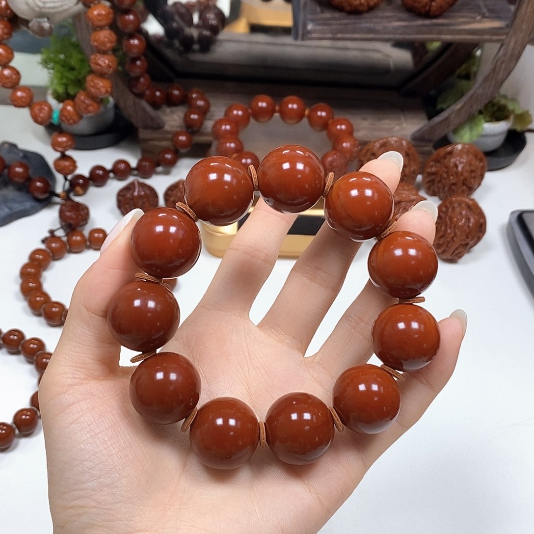 橄榄核把件贝****光珠手串